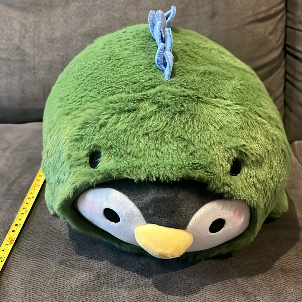 24 inch Penguin in green/blue stegosaurus kigurumi lying down
